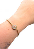 Armbånd: oransje med et blad