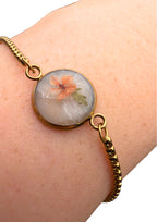 Armbånd: oransje med et blad